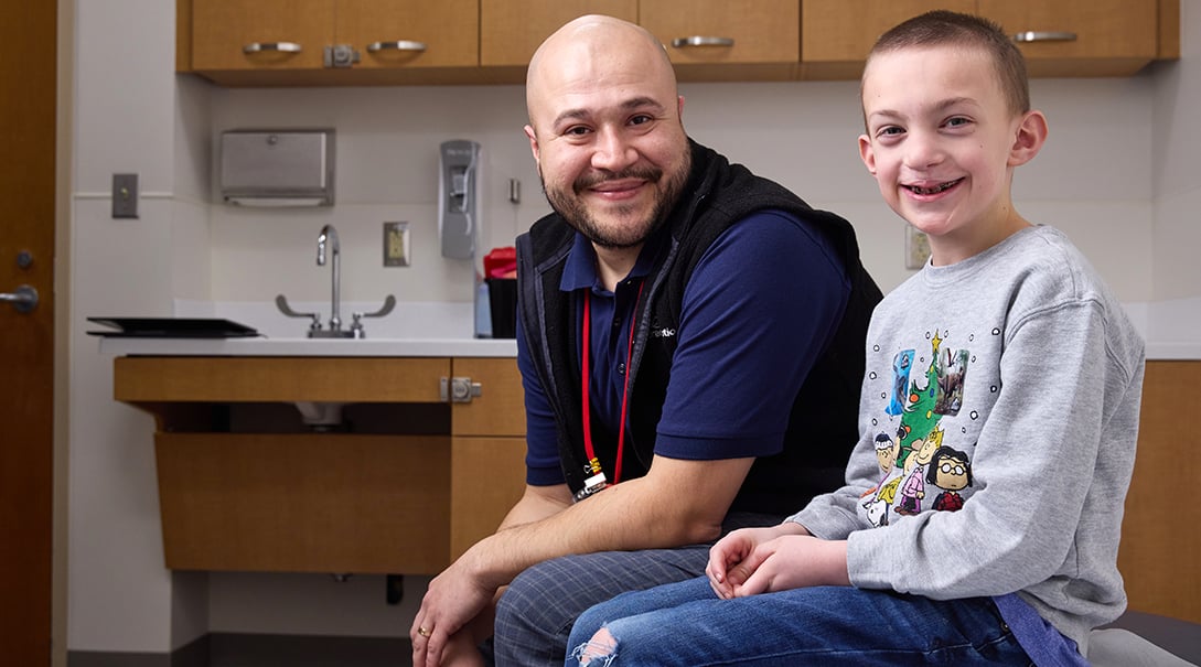 Pedro Flores Canales, program coordinator in our Cleft and Craniofacial Program, with patient Henry.