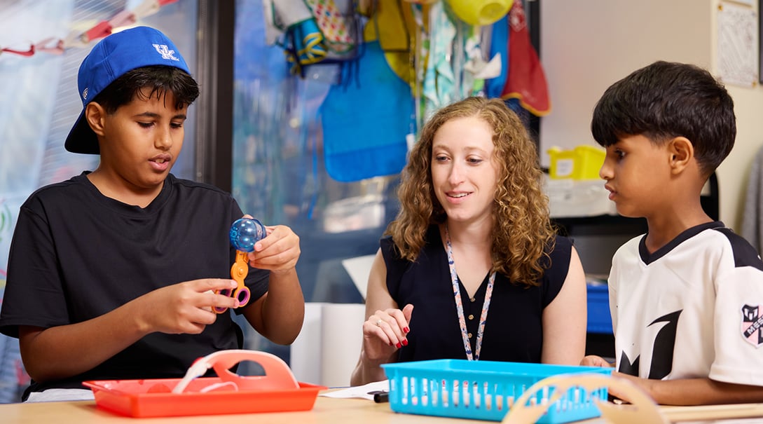 Lauren Schlenger, MA, ATR-BC, LPC, art therapist, with adolescent patients in the Tracy's Kids art therapy studio.