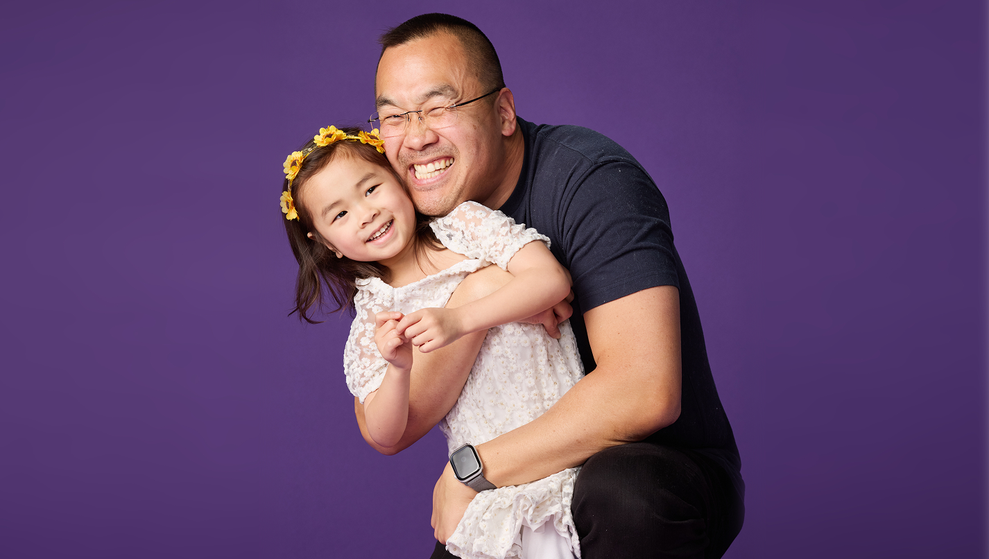 Children's National patient, Mikaela, and her father, Jon, share a hug.