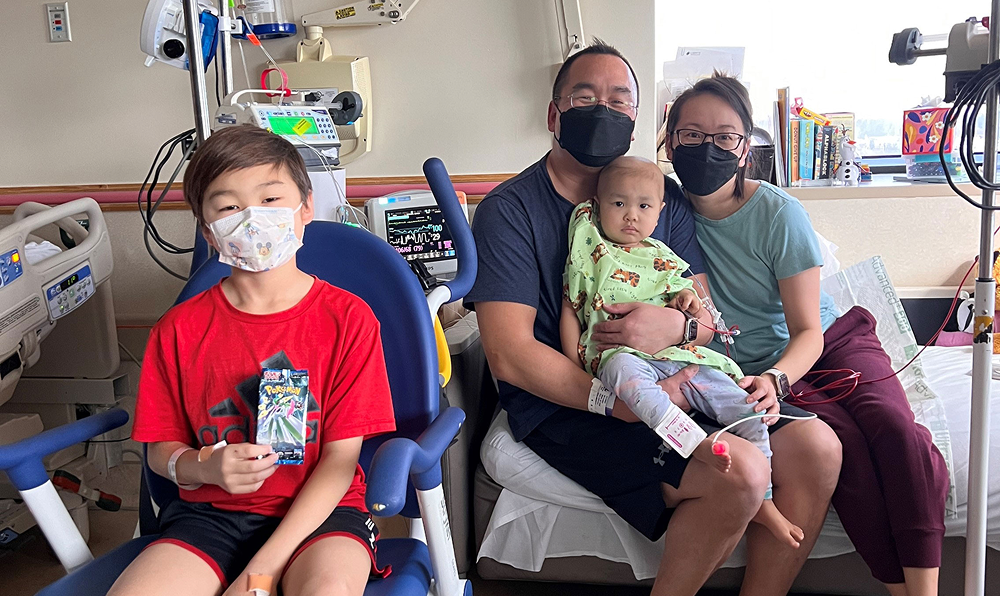 Mikaela with her parents and brother during her hospital treatment.