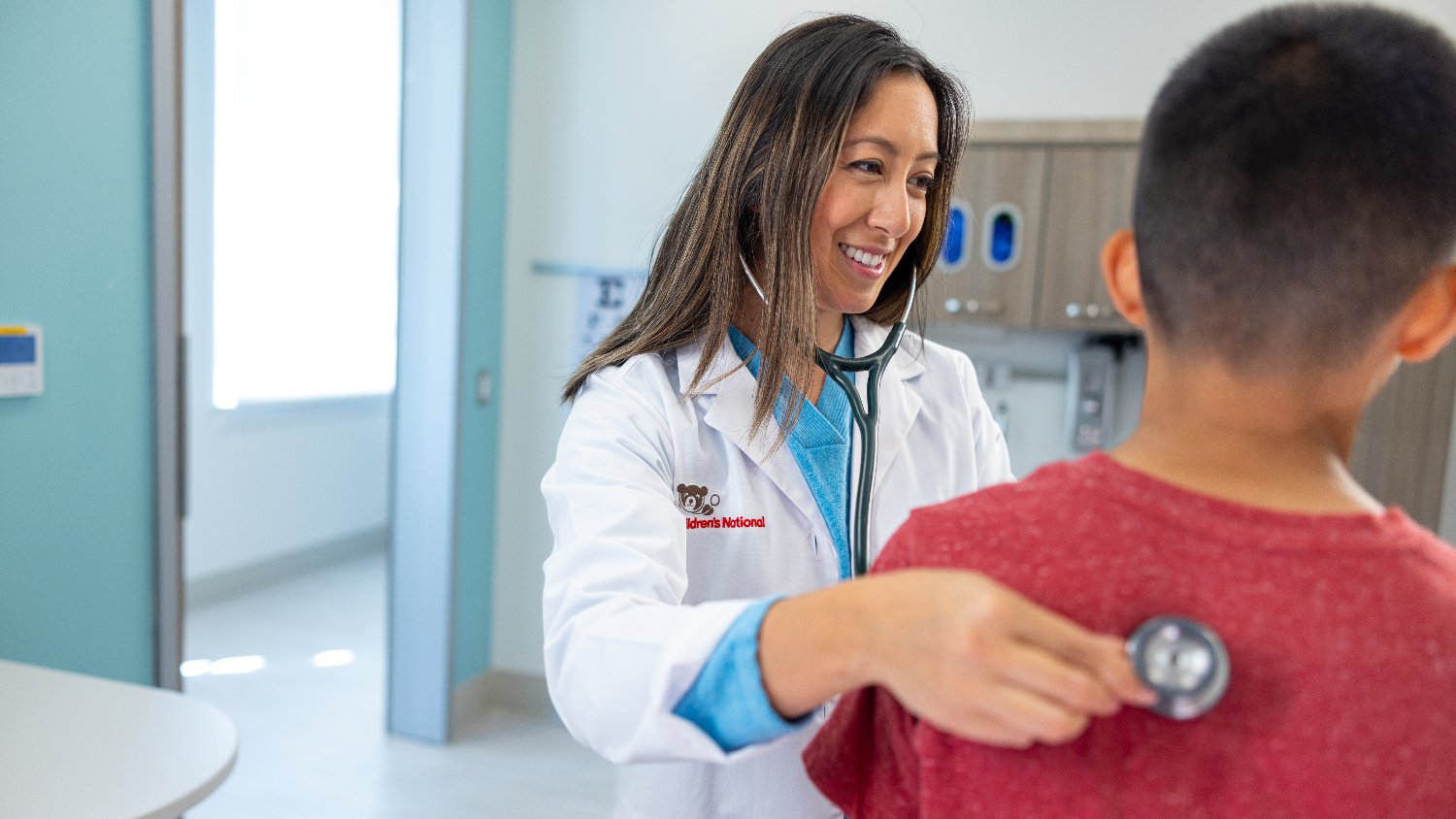 doctor examines child