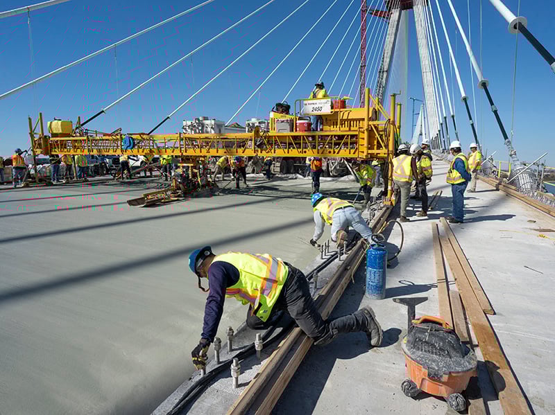 https://edge.sitecorecloud.io/cimicgroupl6308-fdcorpxmclo088b-productioneda2-a2bc/media/project/cimic/flatiron/projects/bridges/gordie-howe-bridge/800x590/paving-gordie-howe.jpg?h=599&iar=0&w=800