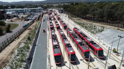 Light rail vehicles lined up photo taken from above