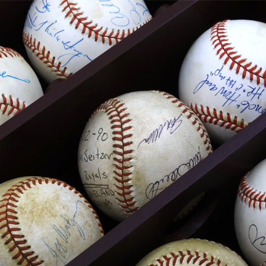 Rows of signed baseballs