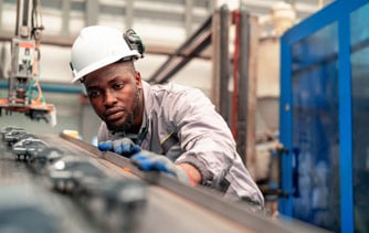 Man inspecting machine