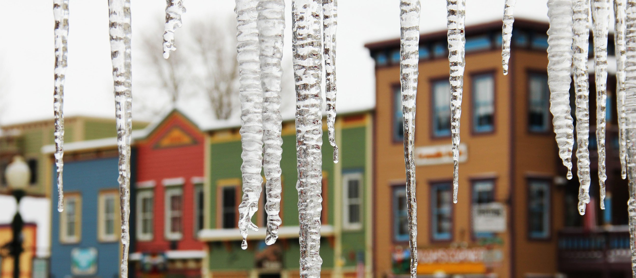 Icicles melting in front storefronts