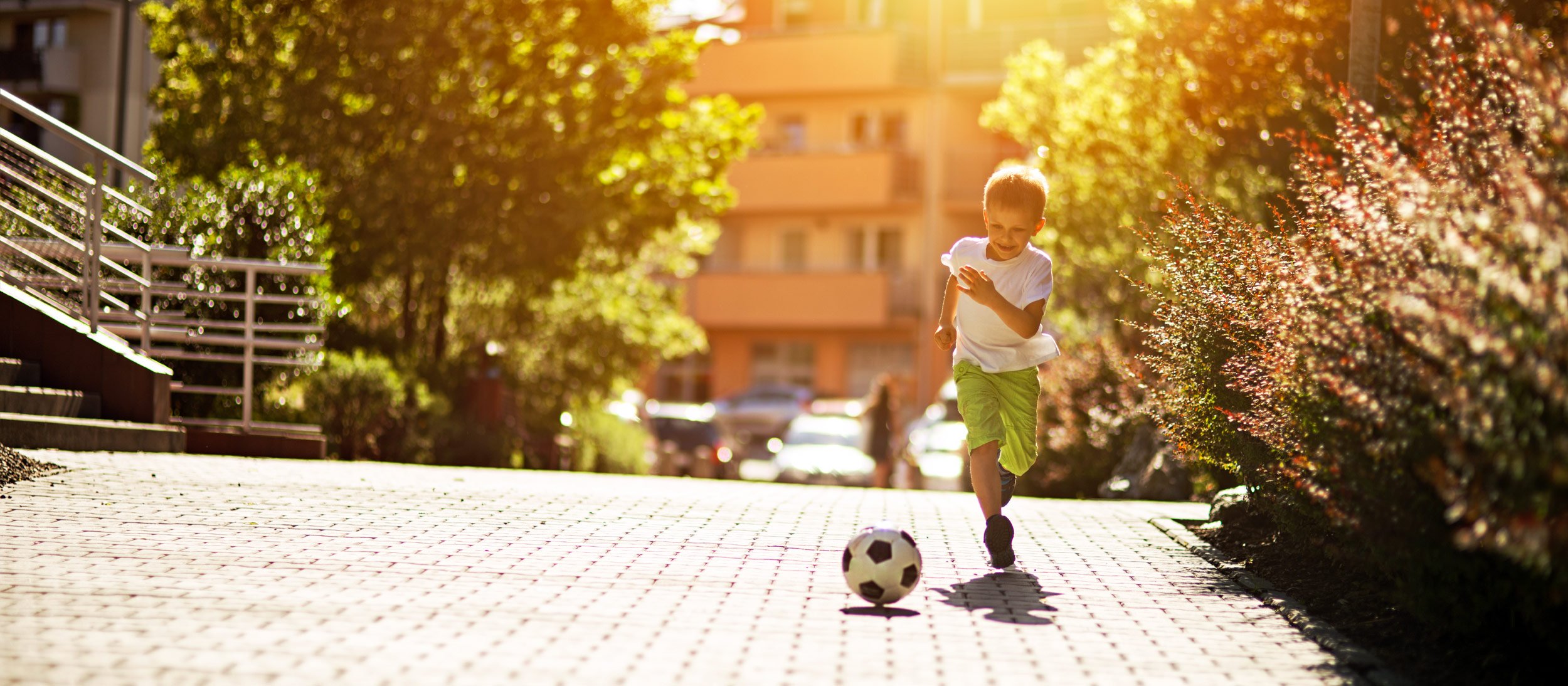 A child dribbling a soccer ball