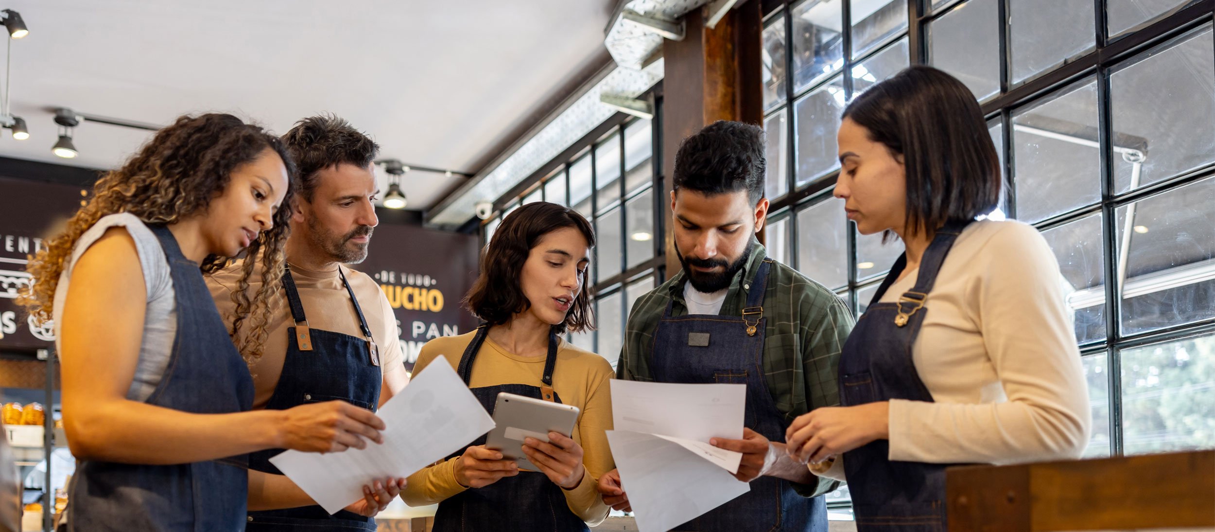 Key employees discussing paperwork