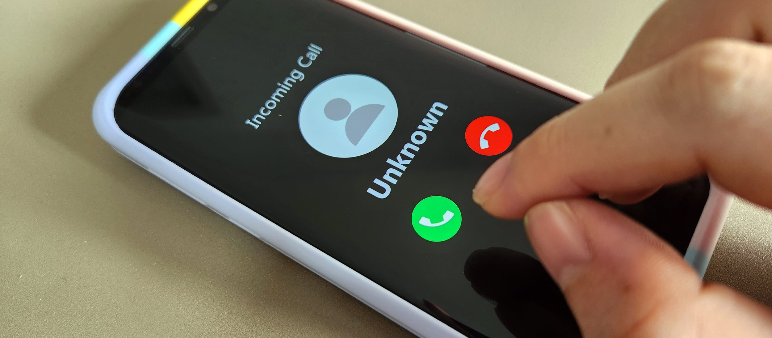 A phone screen shows an incoming call
