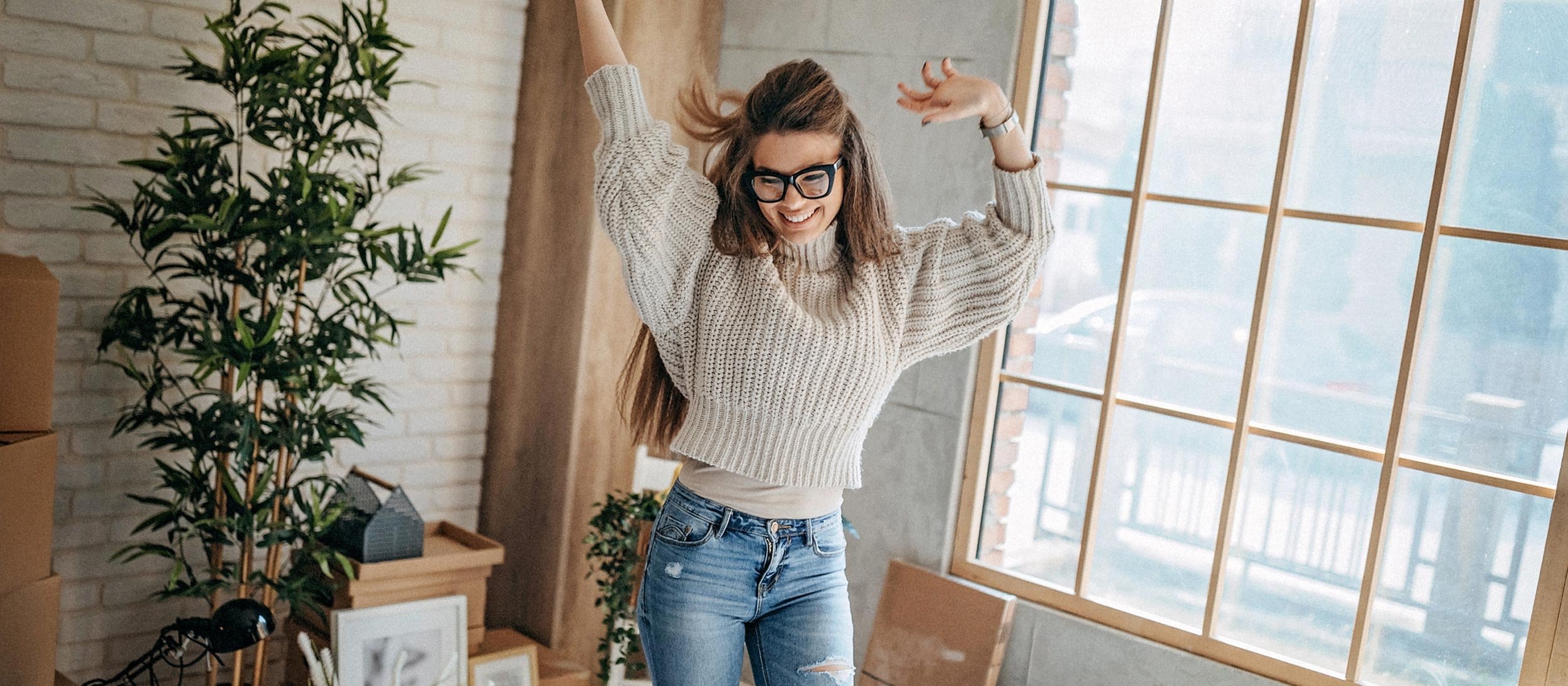 Woman dancing in her apartment