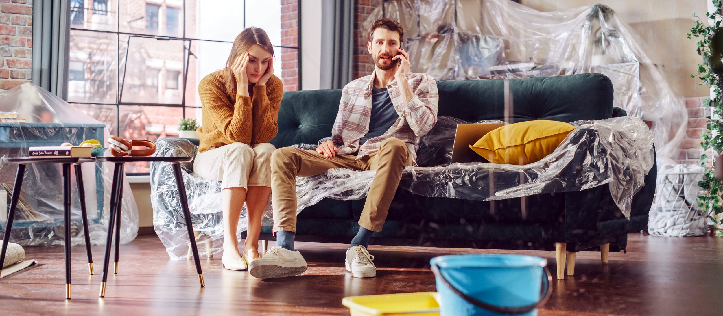 A couple calling for help due to a leak in their ceiling