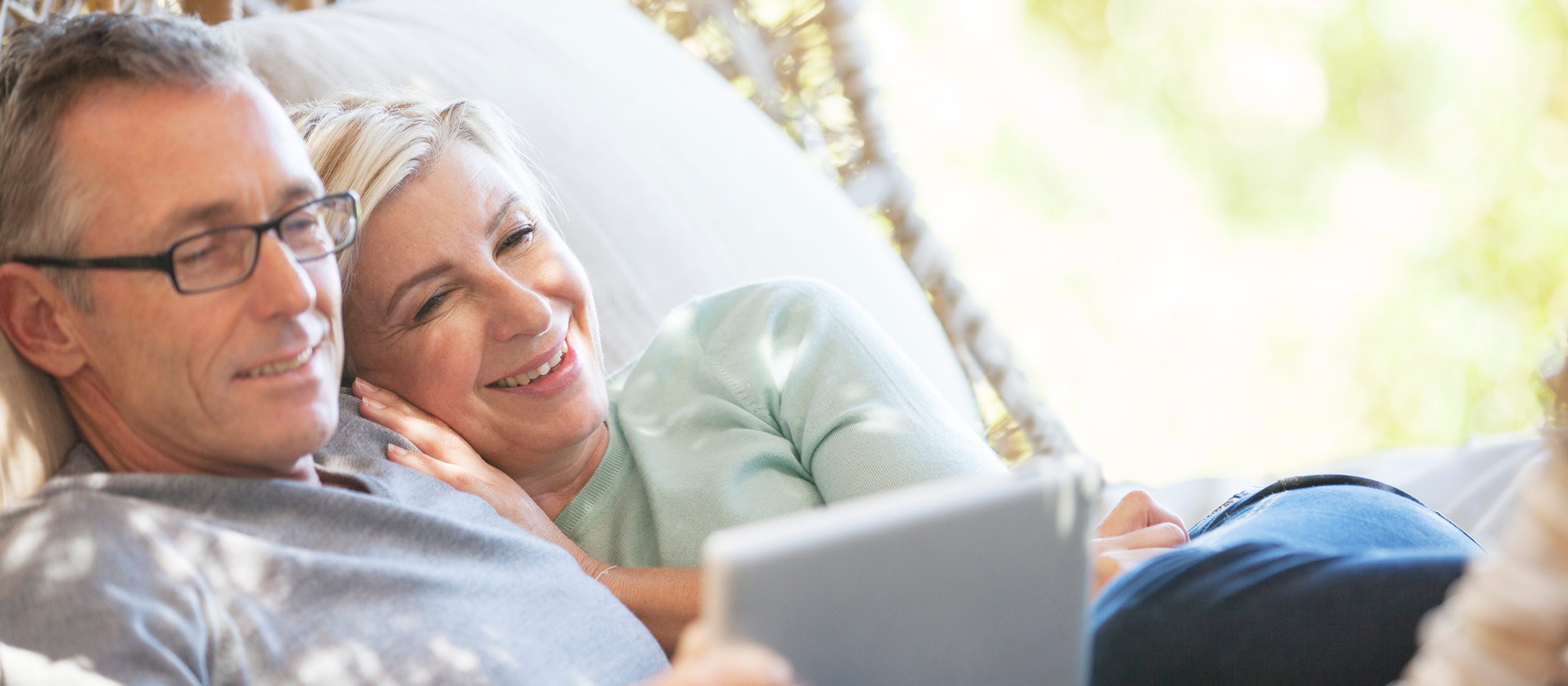 Couple looking at a tablet together