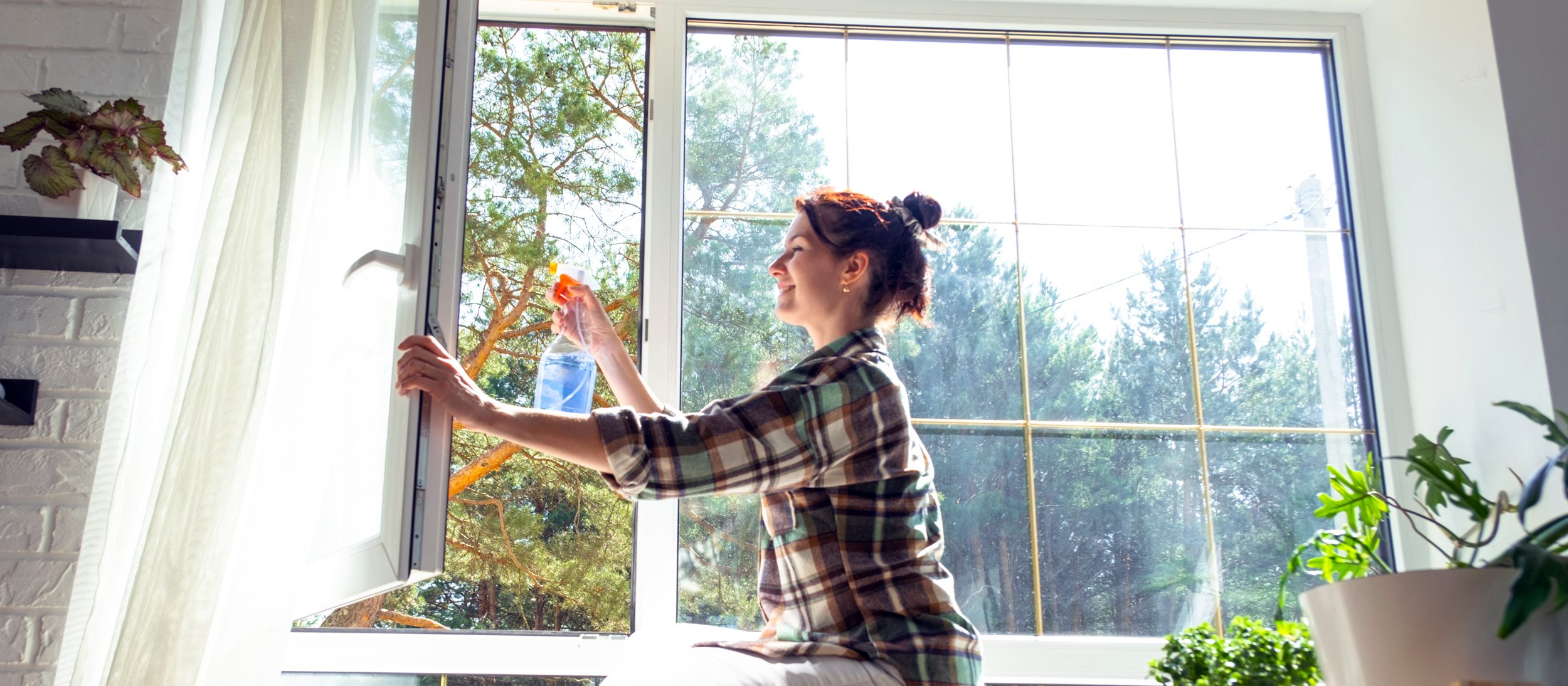 A woman cleaning a window