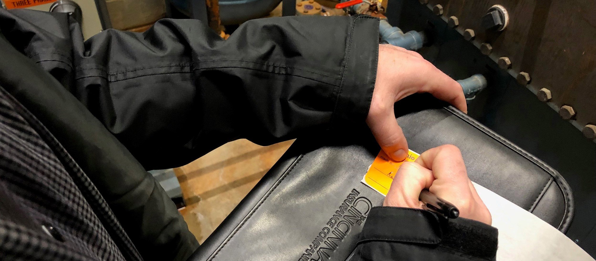 Boiler inspector writing a note