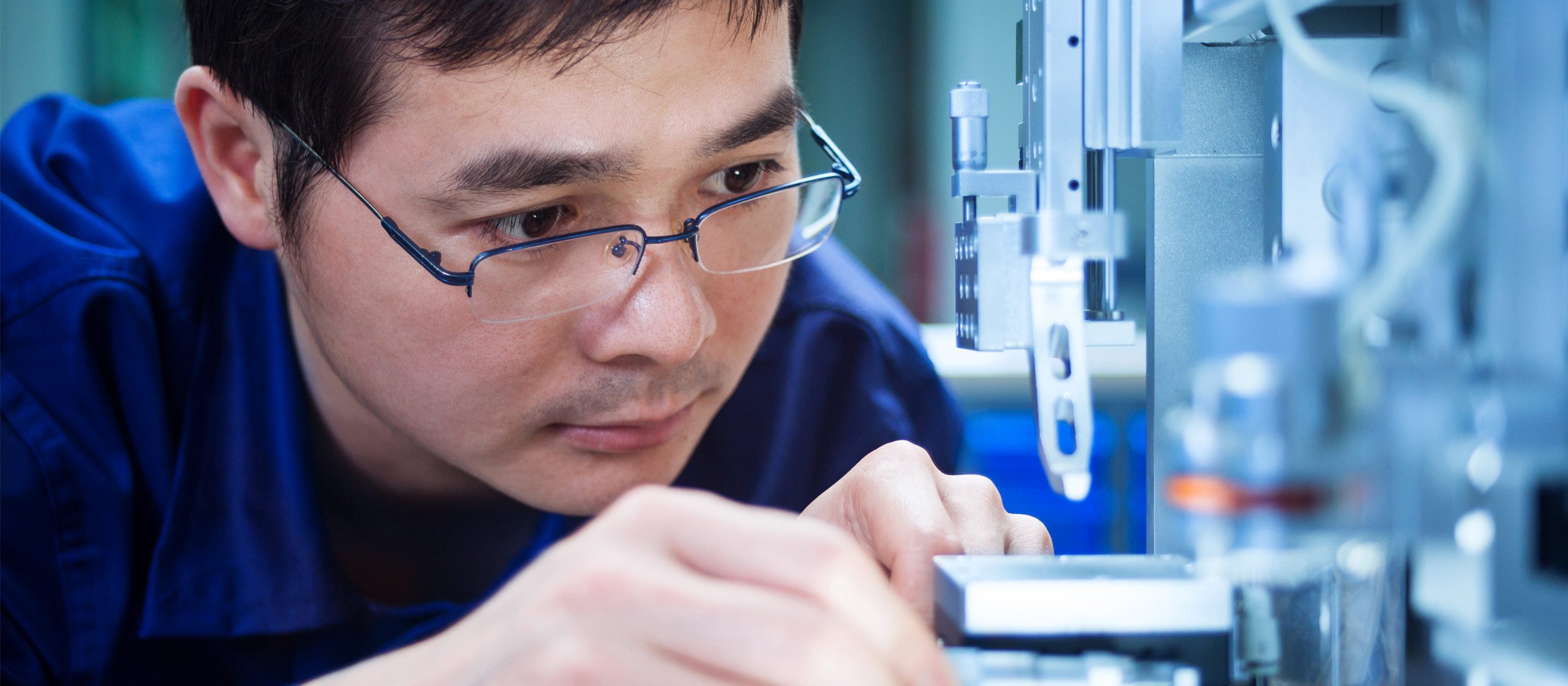 Employee reviewing a machine