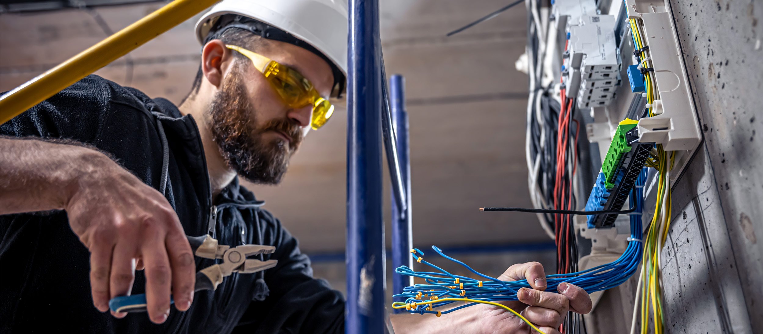 Maintenance worker checking wires