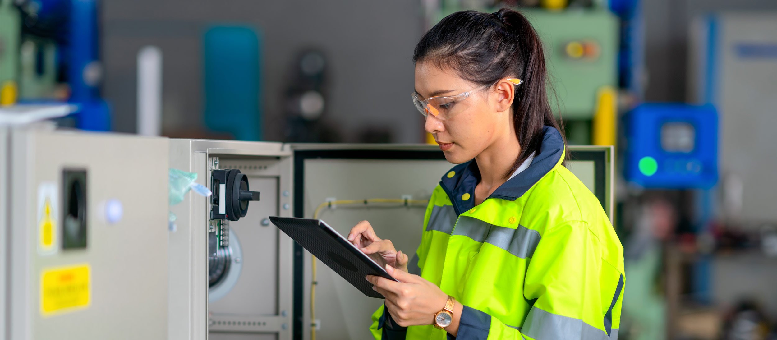 Maintenance worker inspecting a piece of equipment