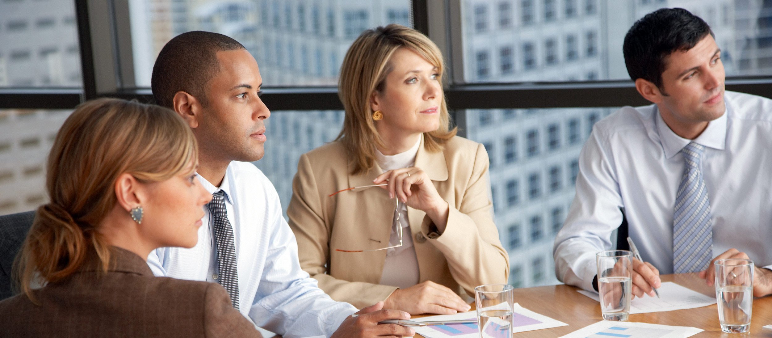 Employees attending a meeting