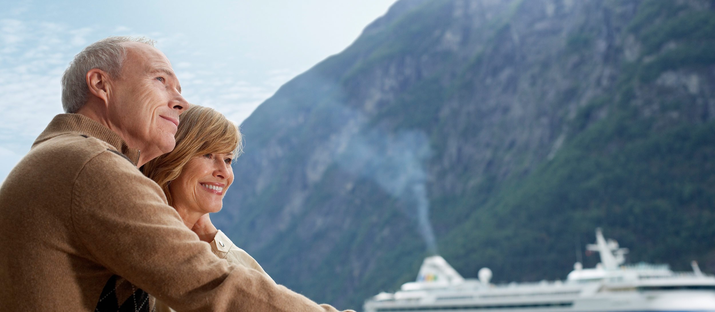 A couple looking at a cruise ship