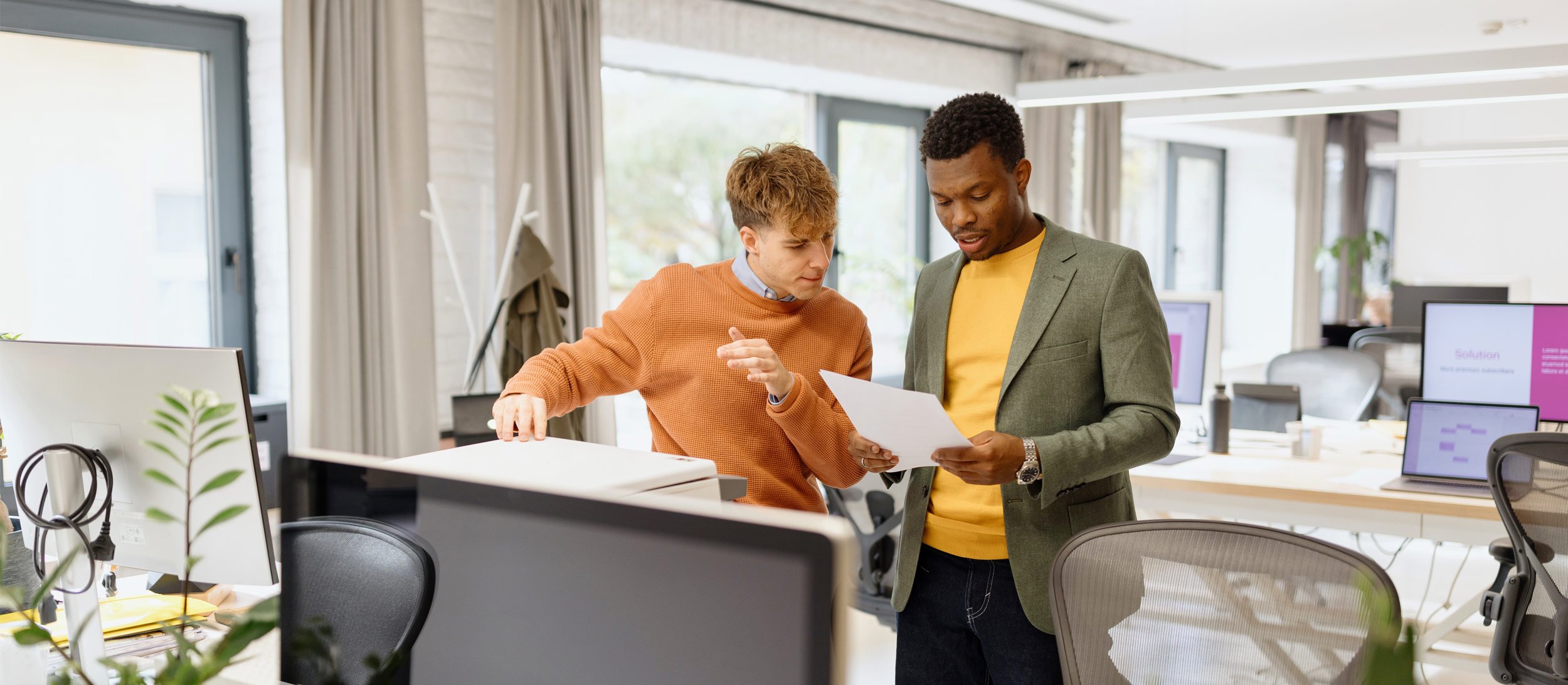 Business partners reviewing paperwork