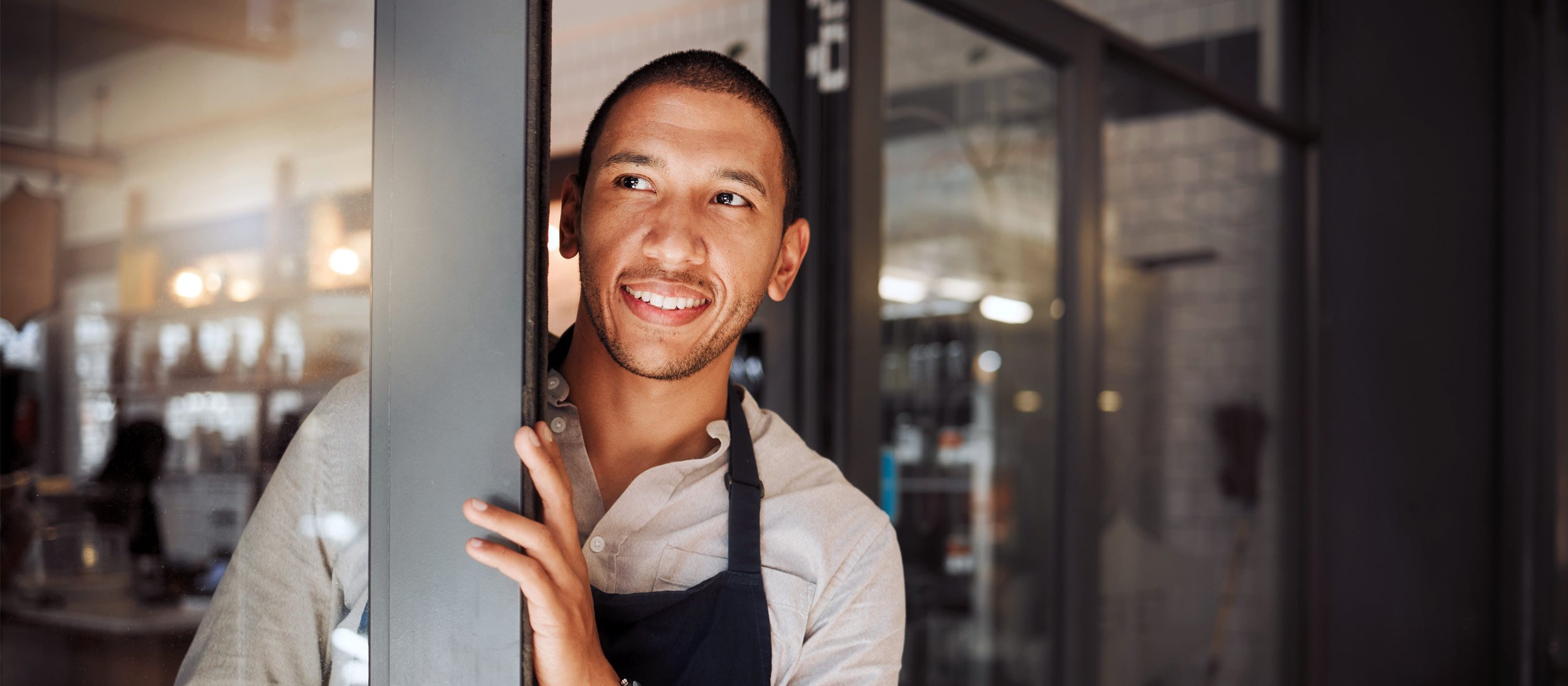 Businessowner opening the door to their business