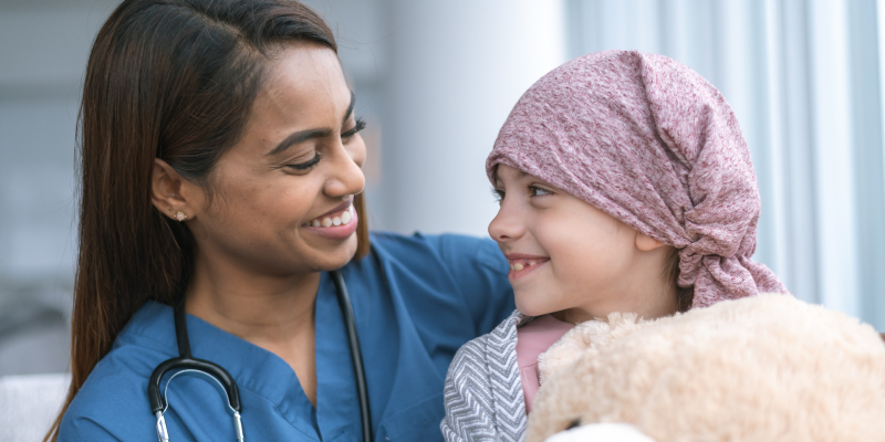 oncology patient and doctor smiling