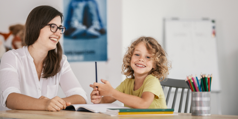 smiling student and teacher