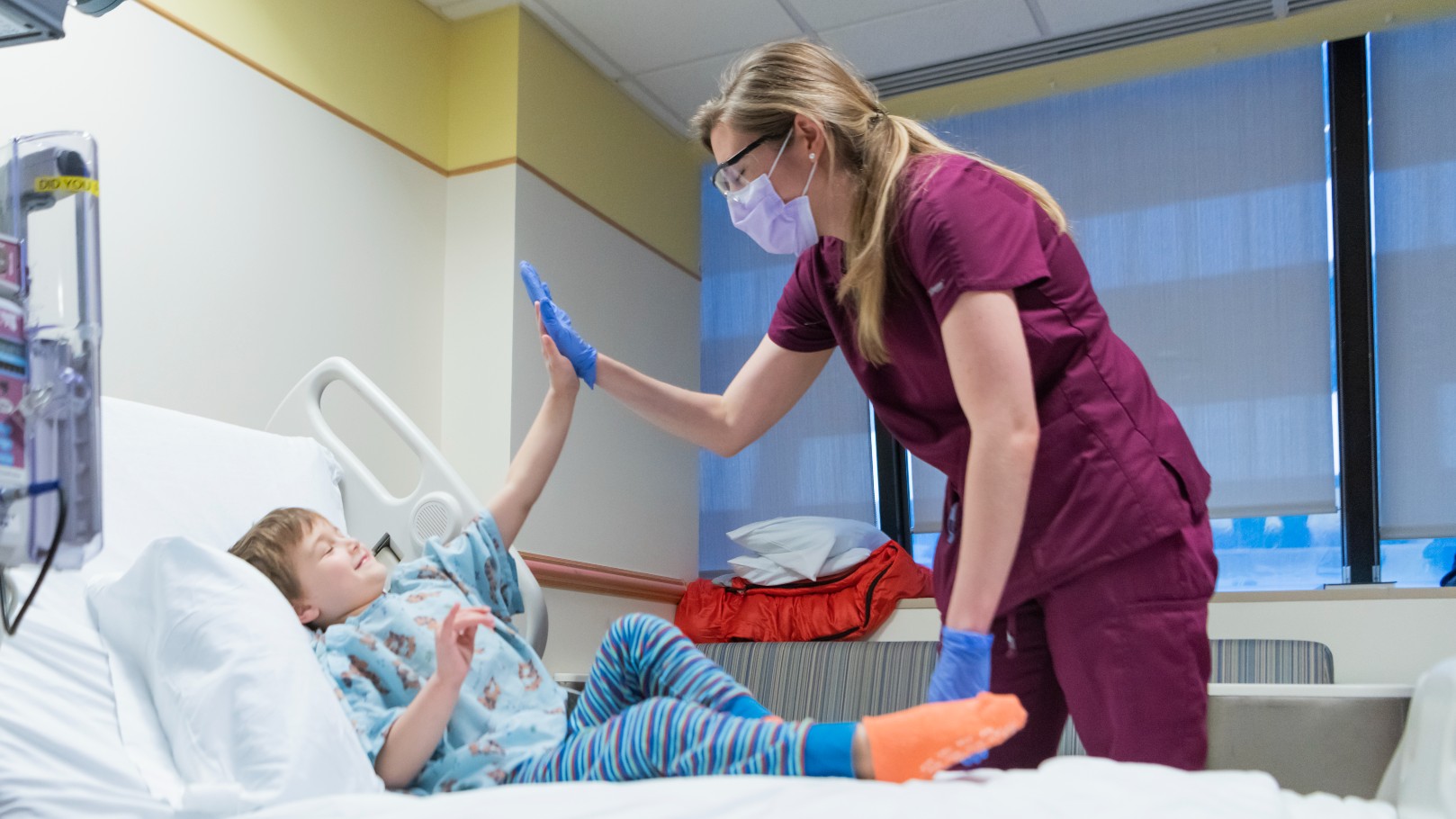 Provider giving young boy a high five