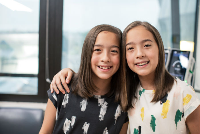 two young girls smiling