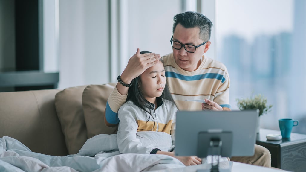 dad takes care of sick child