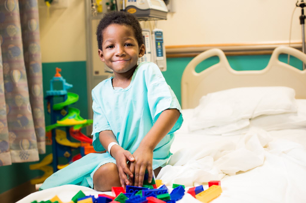 Picture of young patient smiling in exam room