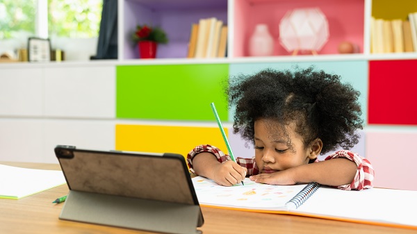 Girl drawing in notebook