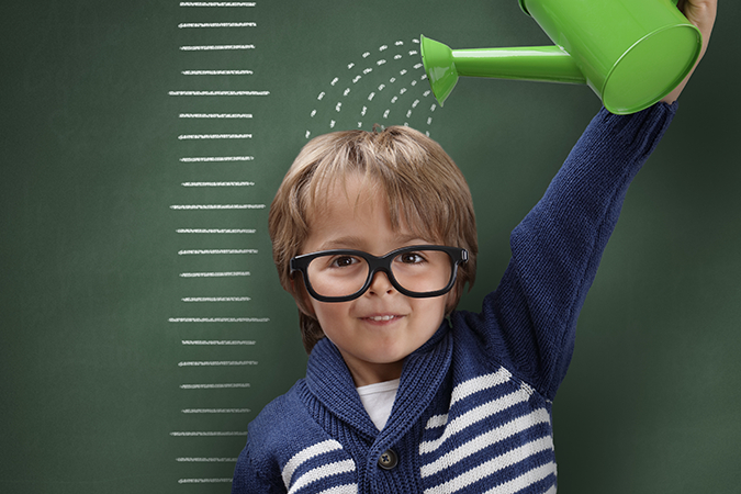 child with watering can