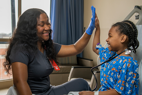 Nurse giving patient ashley moore high five