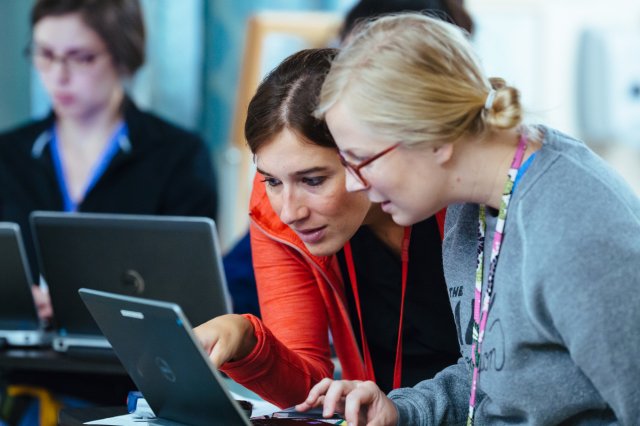 Two women looking at a laptop screen