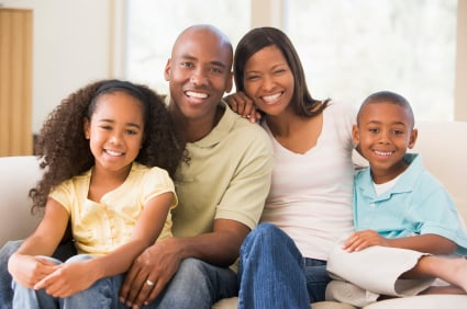 family sitting on couch