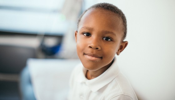 Boy smiling in exam room