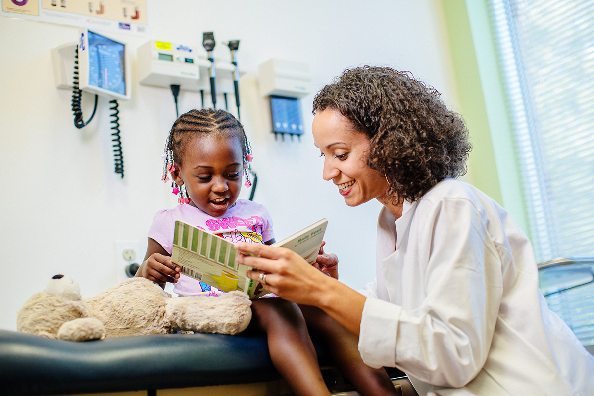 Doctor and patient reading book