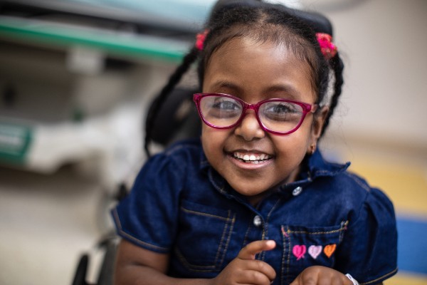 Girl smiling in wheelchair