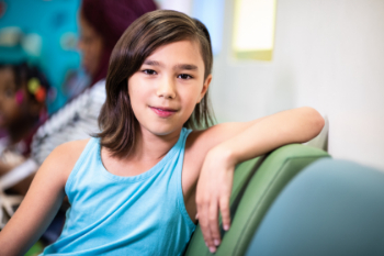 adolescent girl sitting on bench