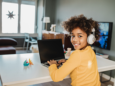 girl studying with laptop at home