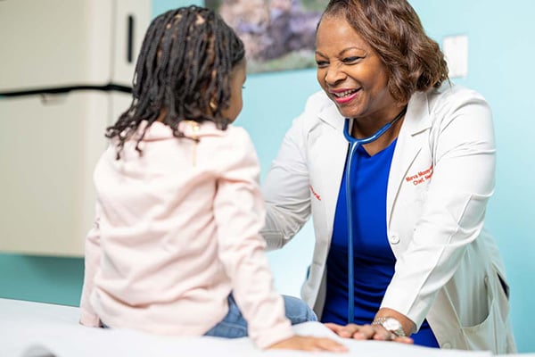 Provider with little girl in exam room