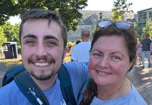 woman and man smiling outside together