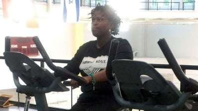 Renesha working out on the stationary bike