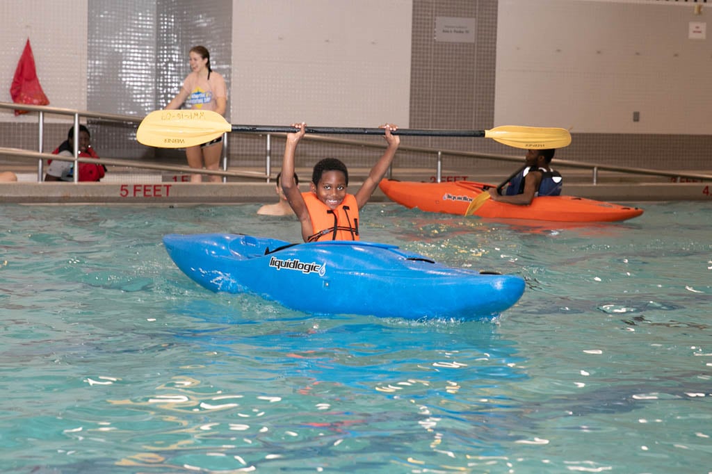 child in canoe