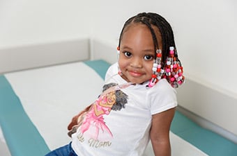 Girl sitting on exam room table