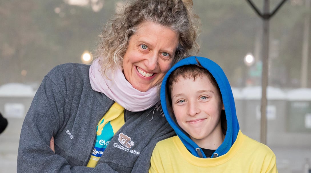 A portrait of a White mother and her child at the Race for Every Child.