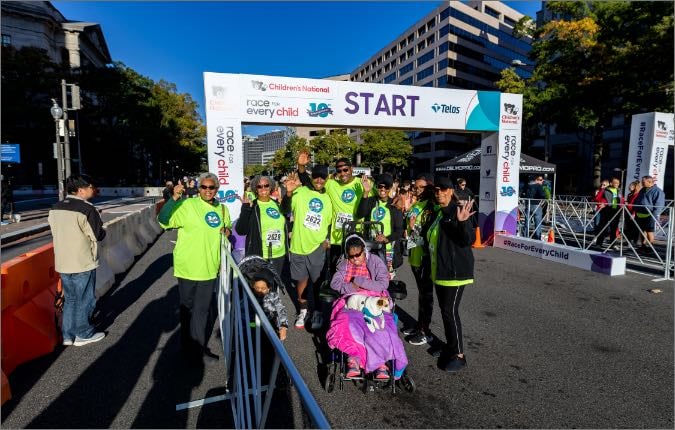 A group of runners poses for a photo at the Race for Every Child.