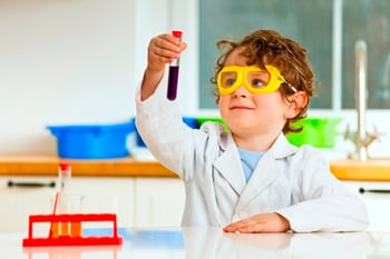 Small child dressed as scientist
