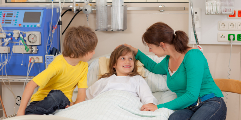 mom and brother visit little girl dialysis